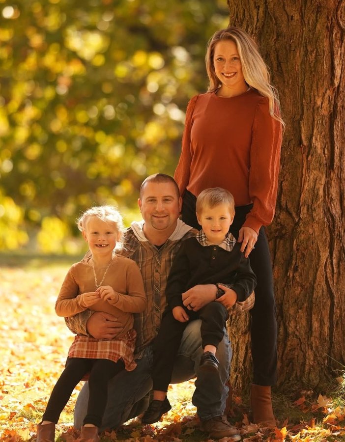 Ryan, Chelsea, Ava and Noah under a big maple tree in the fall